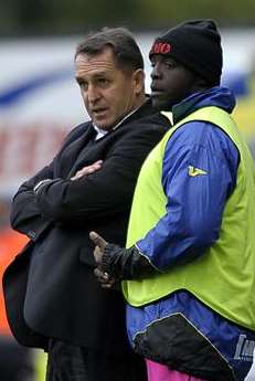 Martin Allen in discussions with Adebayo Akinfenwa at Shrewsbury on Saturday. Picture: Barry Goodwin