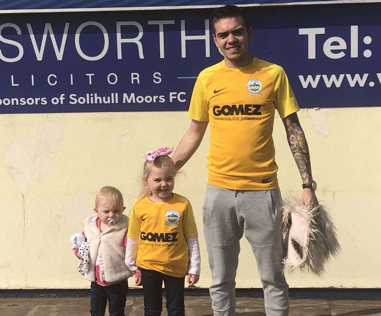 Dover fan Jamie Parsons alongside his daughters, Ellie-May and Iris
