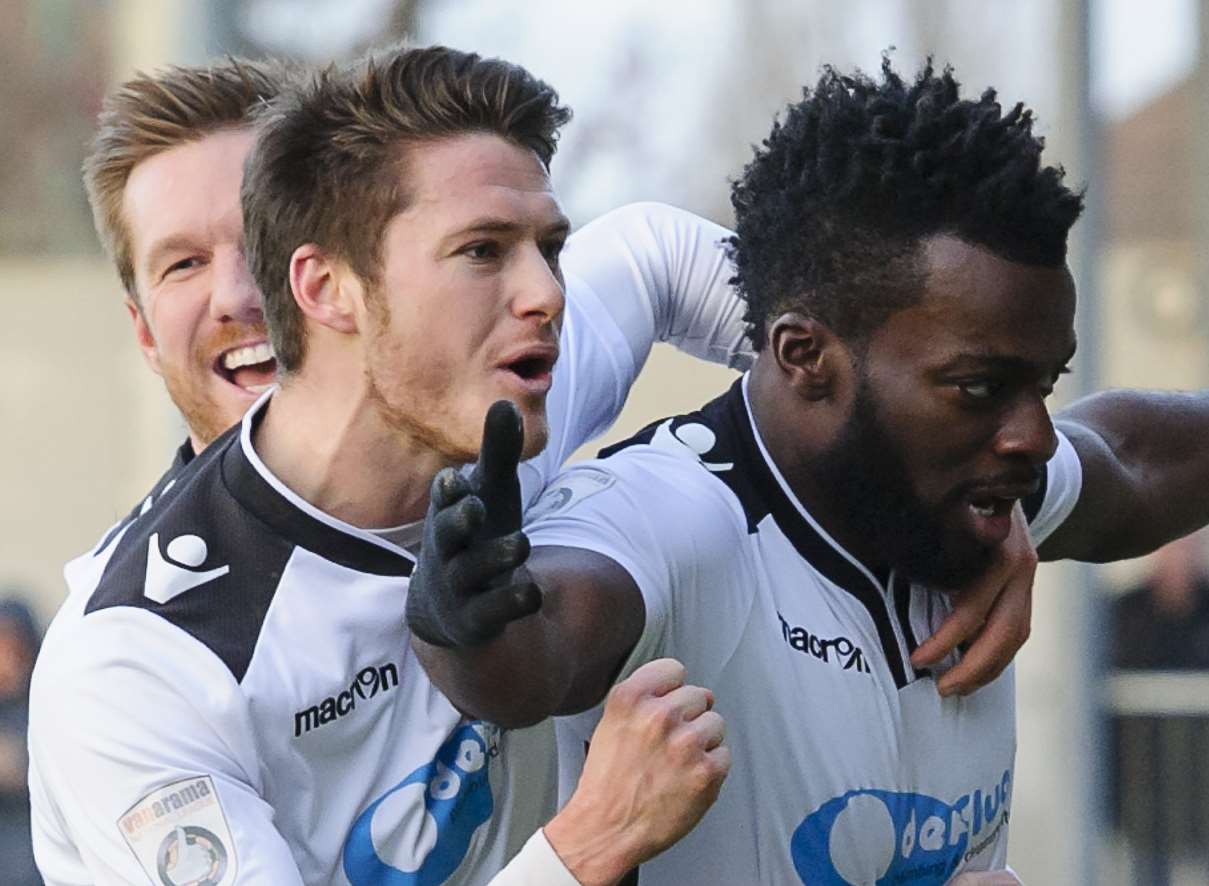 Duane Ofori-Acheampong celebrates his opening goal against Poole Pic: Andy Payton