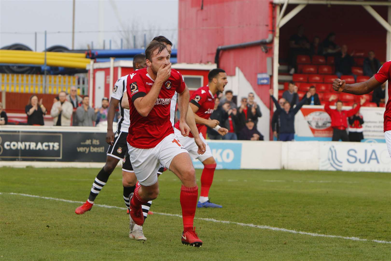 Michael Cheek celebrates his first goal against Wrexham Picture: Andy Jones