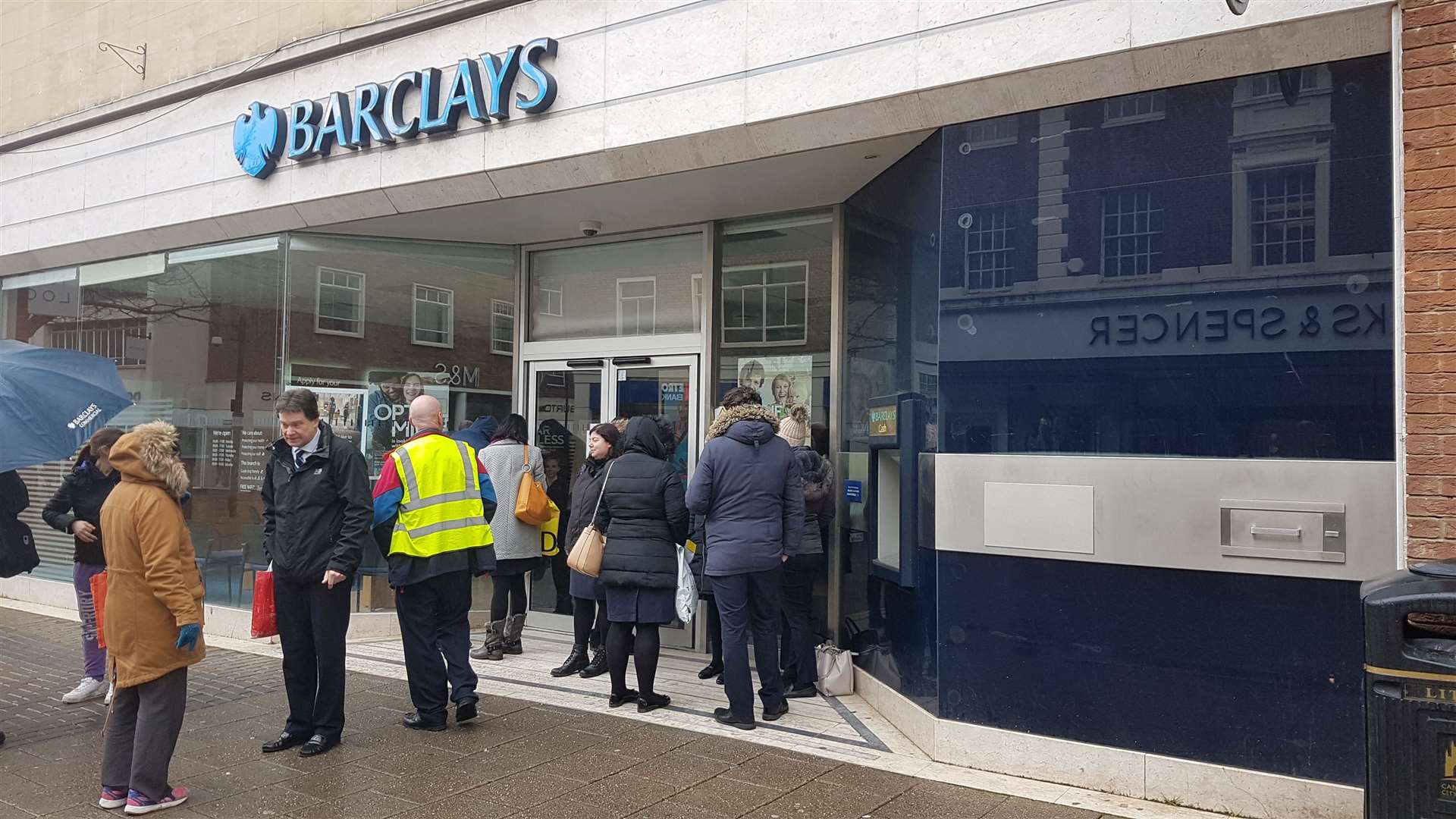 Workers outside the Canterbury branch, where protestors have glued the doors shut