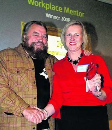Jo receives her award from Brian Blessed