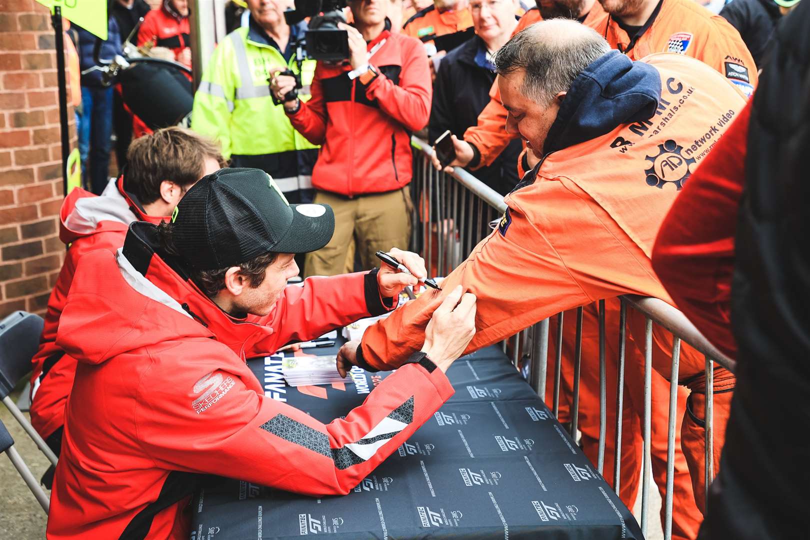 Marshals and spectators met the MotoGP legend during Sunday's pitlane walkabout