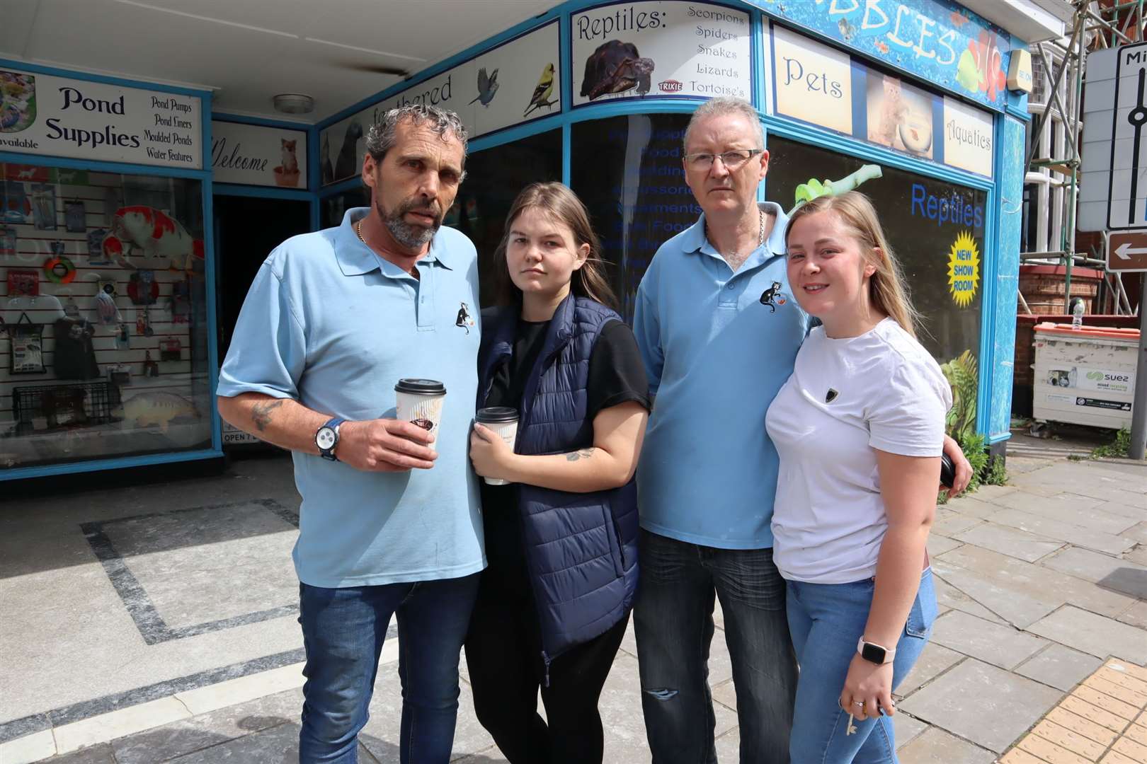 Alec Smith outside Cuddles n Bubbles pet shop in Sheerness Broadway with his shocked staff Megan McCarthy, Steve Bristow and Casey Andrews