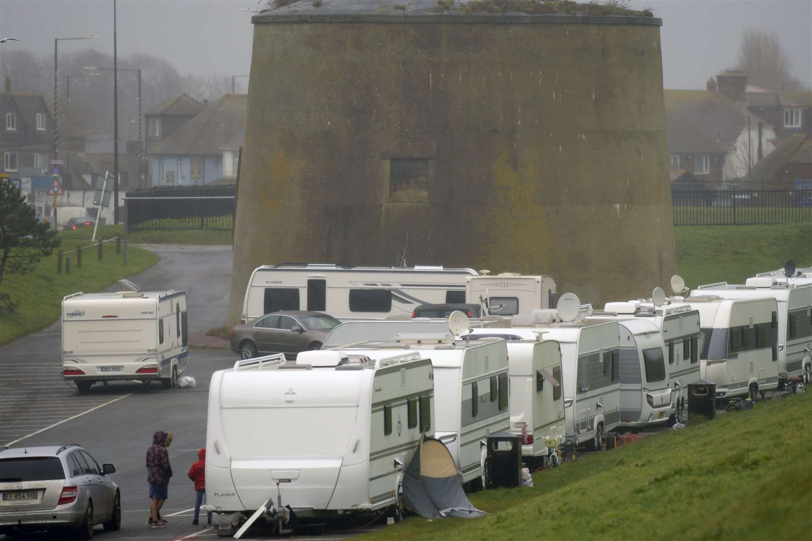 Caravans, all with foreign number plates, have pitched up in the car park. Picture: Barry Goodwin