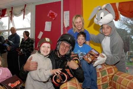 Chairman of Associated Sheppey Bikers Reanato Magri and son Marc (Easter Bunny) with delighted youngsters from Preston Skreens David Coomber, (13) and Samuel Boakes, (11) with clinical support worker Cheryl Dayman.