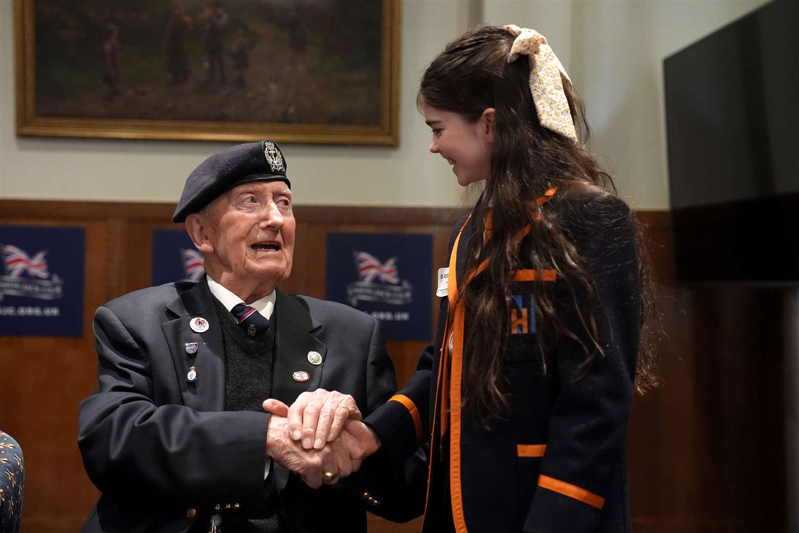 D-Day veteran and Ambassador for the British Normandy Memorial Stan Ford, 98, who served with the Royal Navy, meeting a pupil from Norfolk House School (Gareth Fuller/PA)