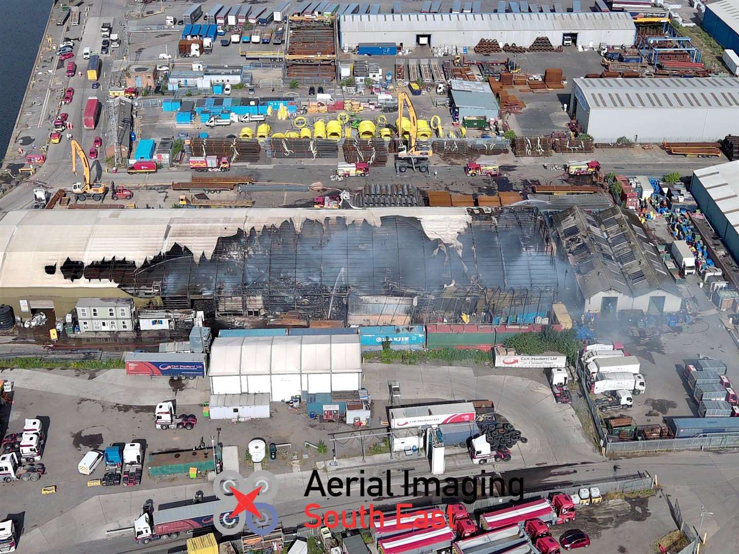 Drone images show the extent of the damage to the warehouse at Chatham Docks. Picture: @AerialimagingSE