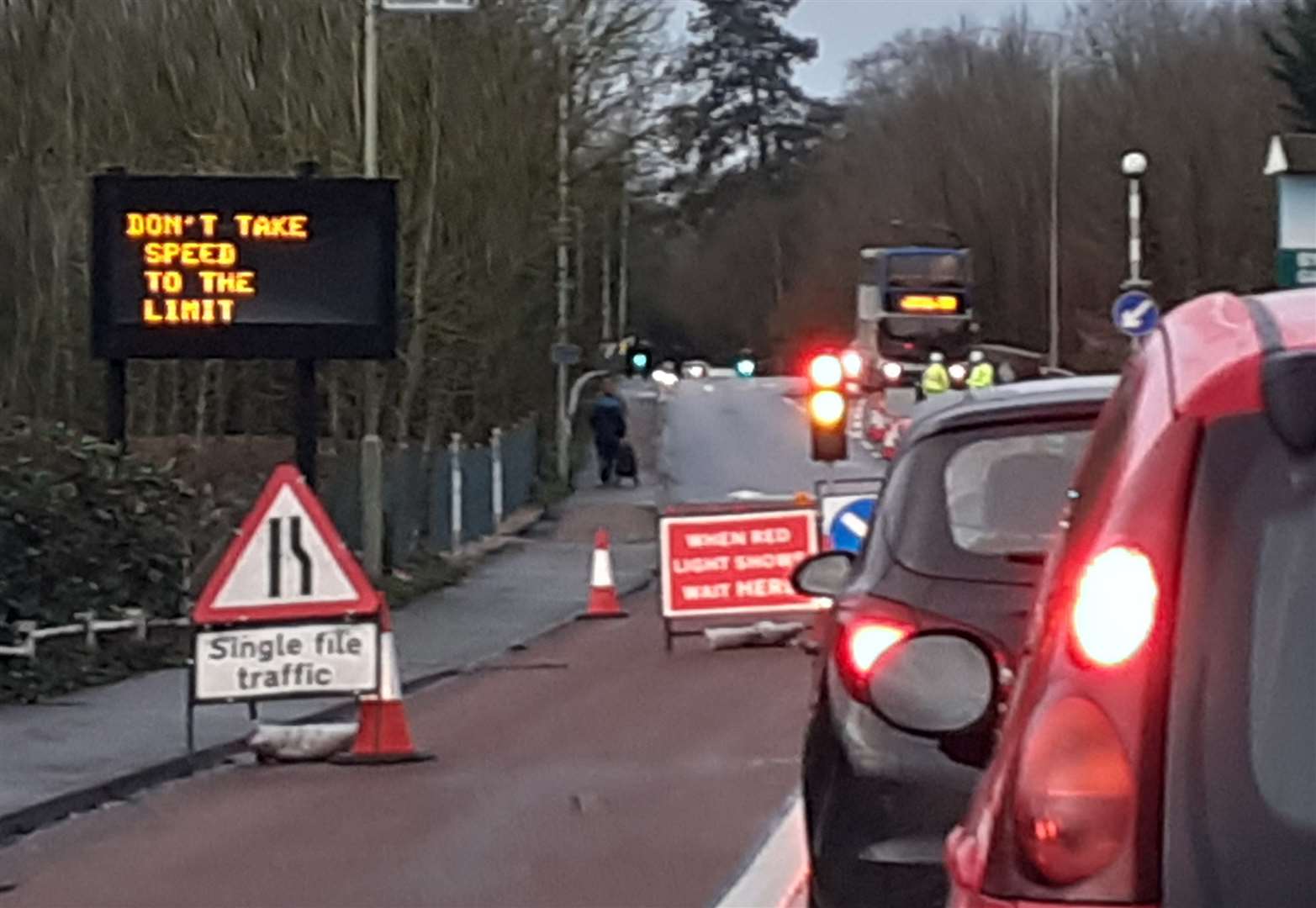 The lights have been installed next to a 'don't take speed to the limit' sign