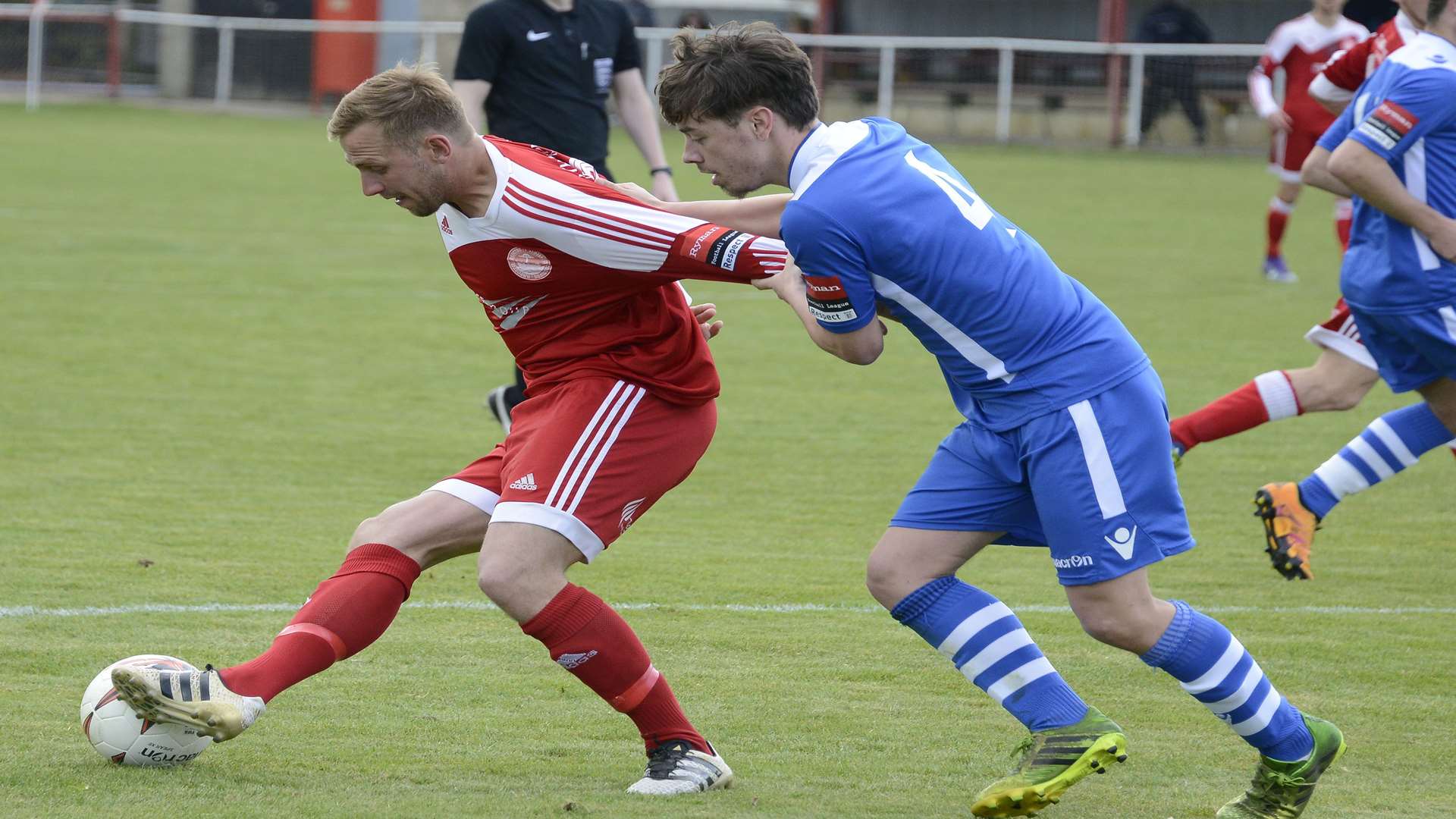 Chats' Josh Gibson (blue) tussles with Hythe's Sam Adams on Monday Picture: Paul Amos