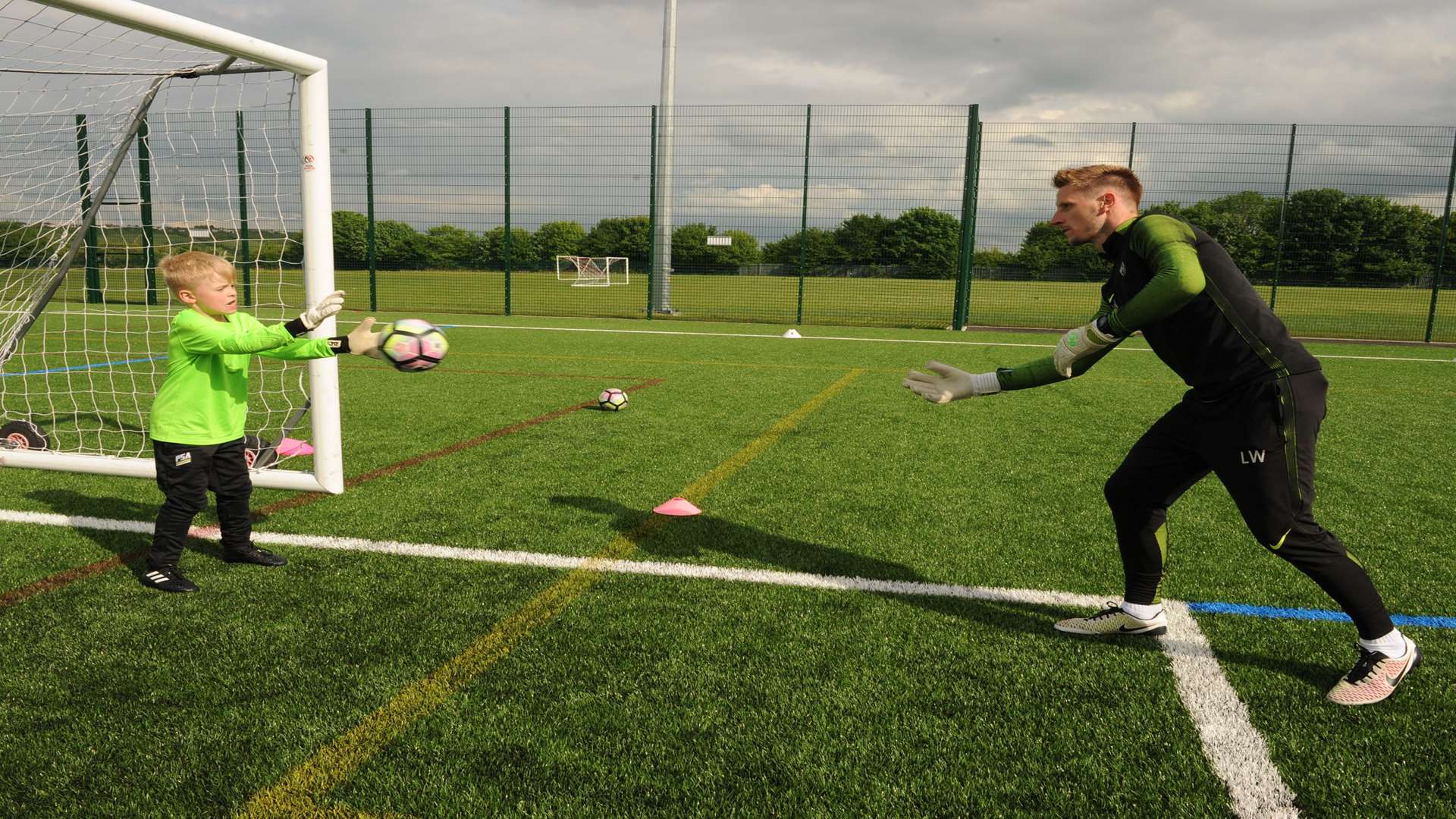 Maidstone keeper Lee Worgan coaches seven-year-old Harry Fowle Picture: Steve Crispe