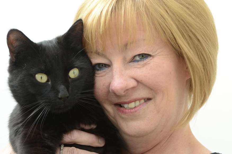 Karen Jones, from Kennington, with pet cat Norman after his 'resurrection'