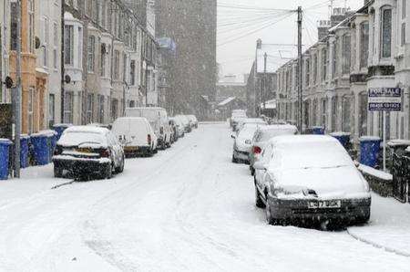 Thick snow covers cars in Delamark Road, Sheerness