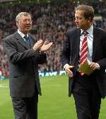 Alan Curbishely is applauded by United boss Sir Alex Ferguson. Picture: MATTHEW WALKER