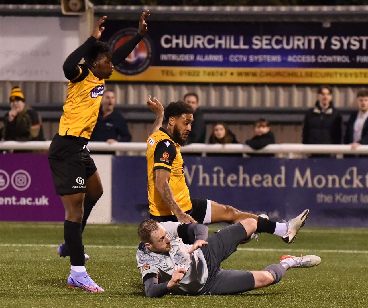 Reece Grant in the thick of things for Maidstone as Jermaine McGlashan looks on Picture: Steve Terrell
