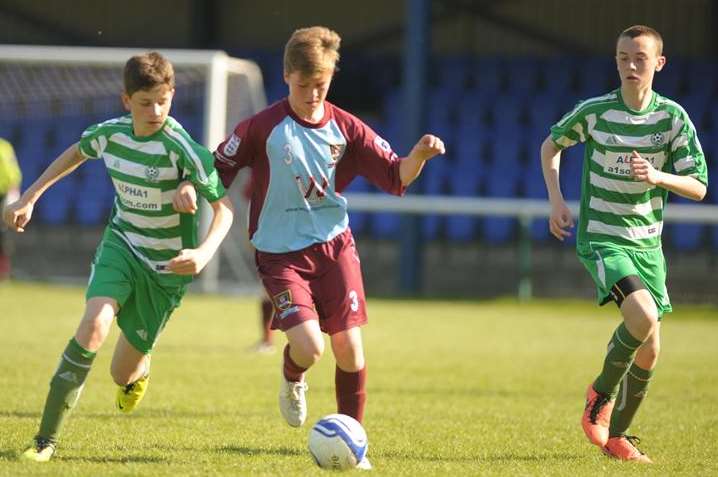 Eagles (green) challenge Wigmore Youth in the under-14 John Leeds Trophy final Picture: Steve Crispe