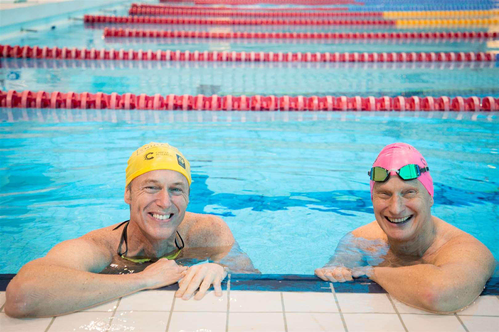 Swimming champs Mark Foster, left, and Duncan Goodhew who is Swimathon president. Picture: Cancer Research UK