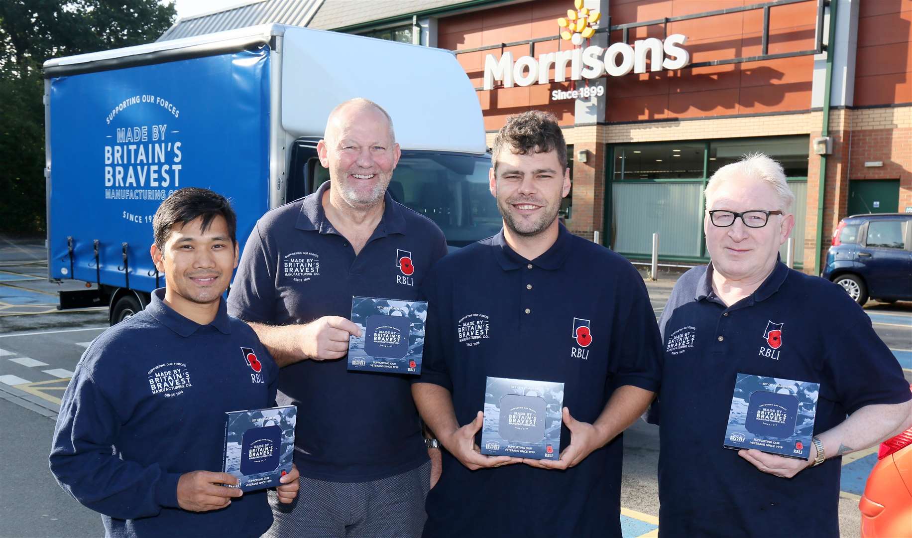 Workers at RBLI's Britain's Bravest Manufacturing Company make the first delivery of coasters (16711686)