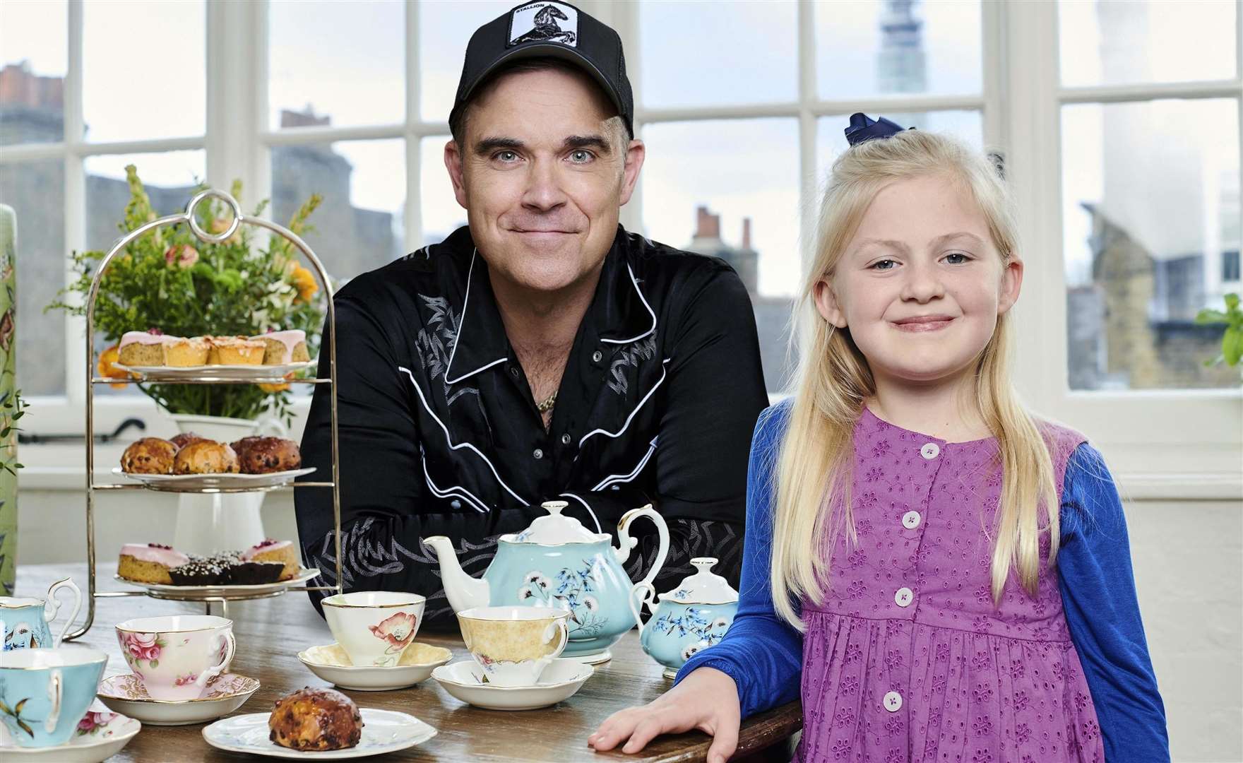 Robbie Williams with Clara Ross, who voice Sophie in The Tiger Who Came to Tea on Channel 4