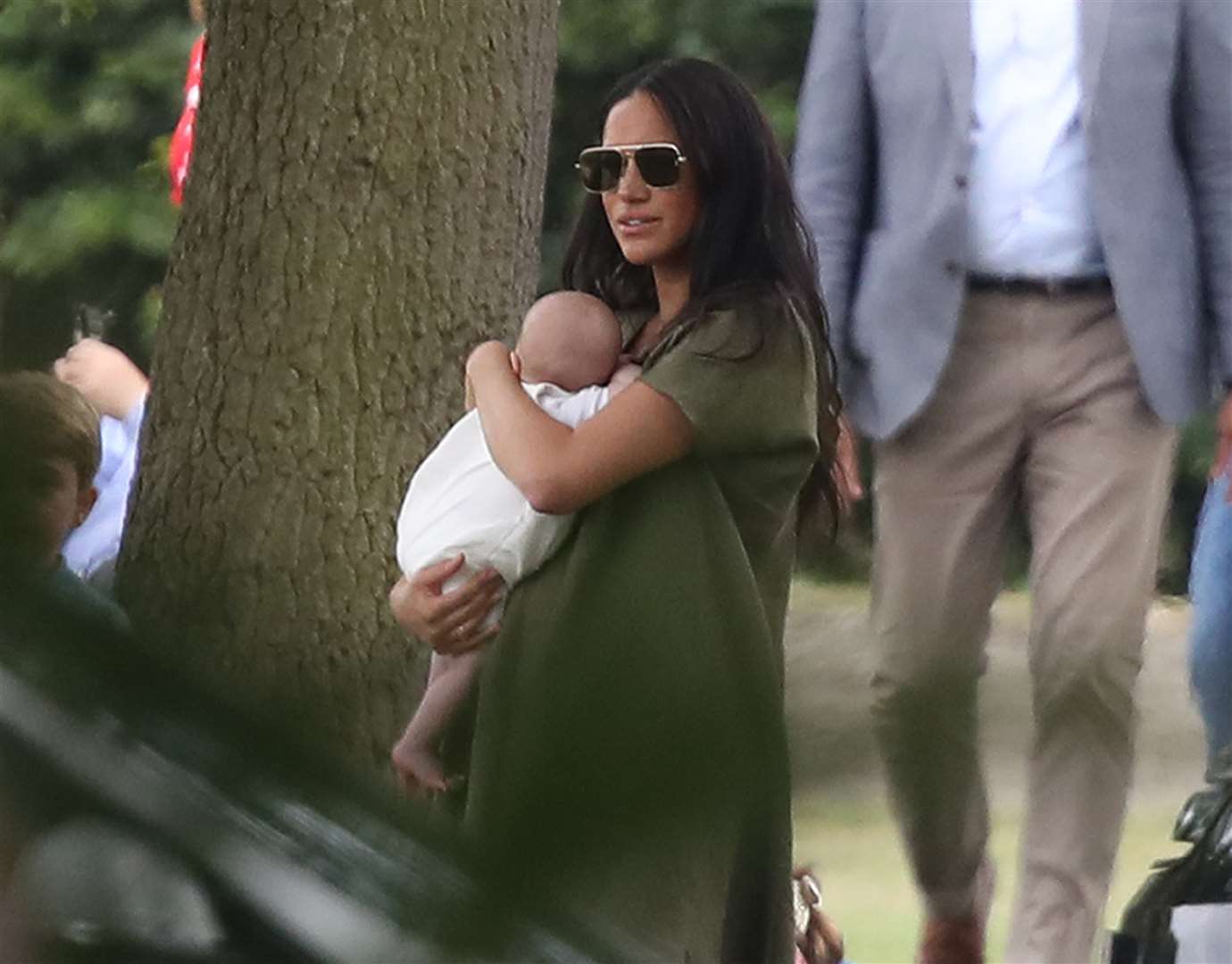 Meghan holds Archie as they attend the King Power Royal Charity Polo Day in July (Andrew Matthews/PA)