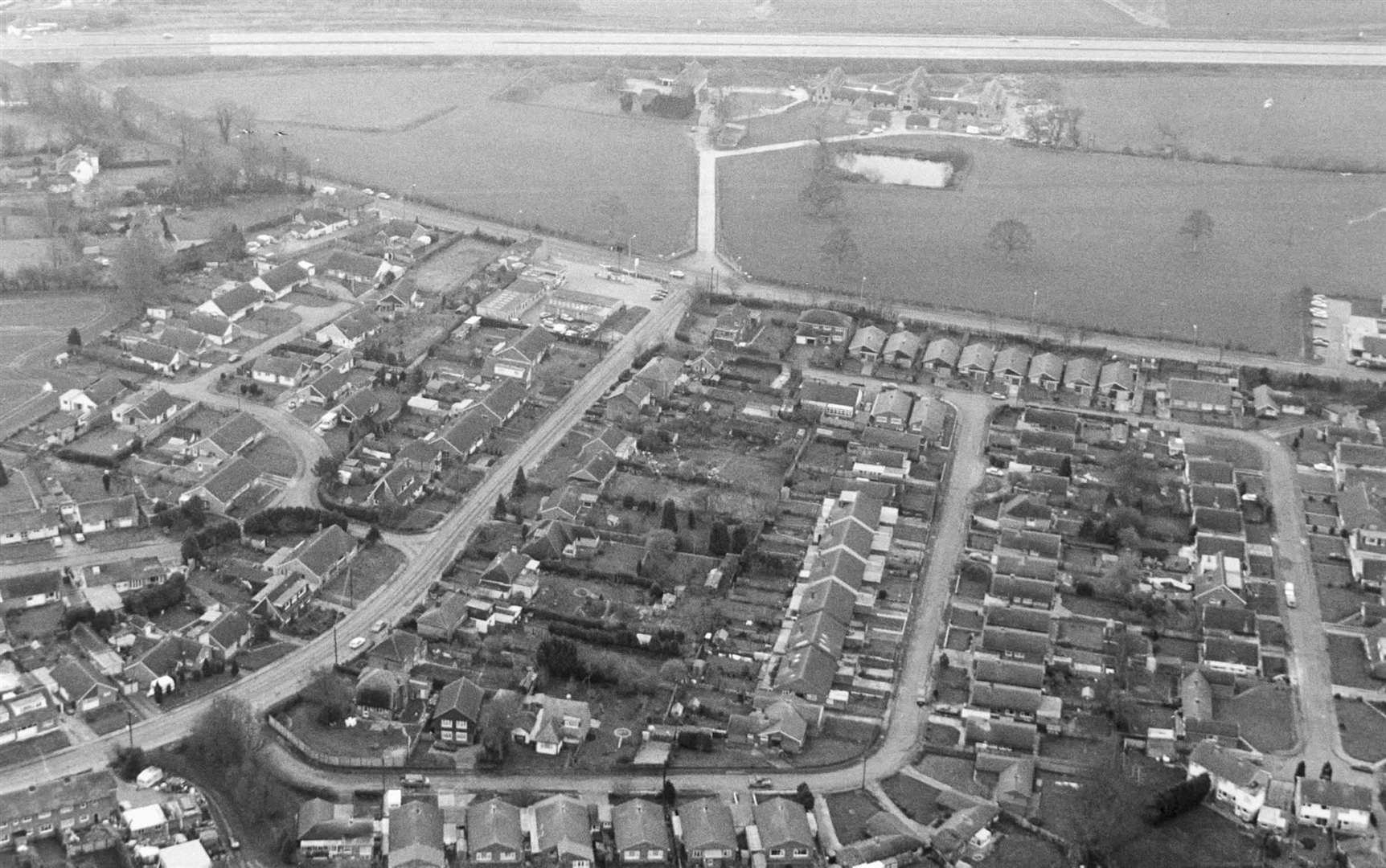 Sellindge from above in 1989. Scores of homes are proposed or currently being constructed around the village