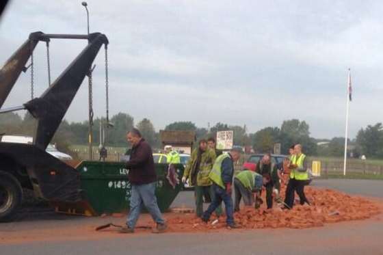 Lorry sheds its load of bricks on the Hop Farm roundabout. Picture: Mark Gosy