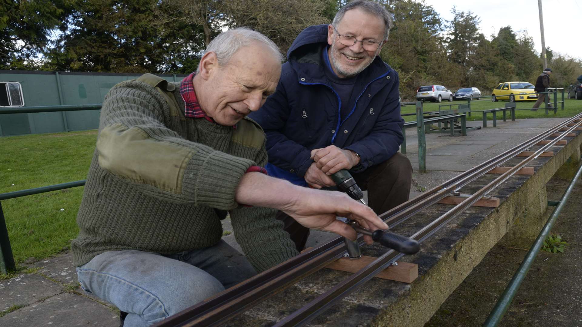 Peter Skelton and Clive Mowatt at work on re-instating the miniature railway track.