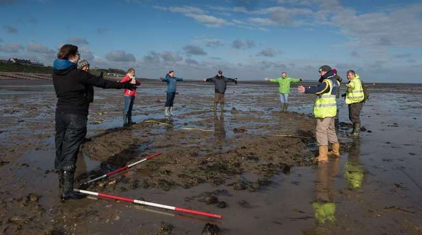 Volunteers showing the outline of the wreck