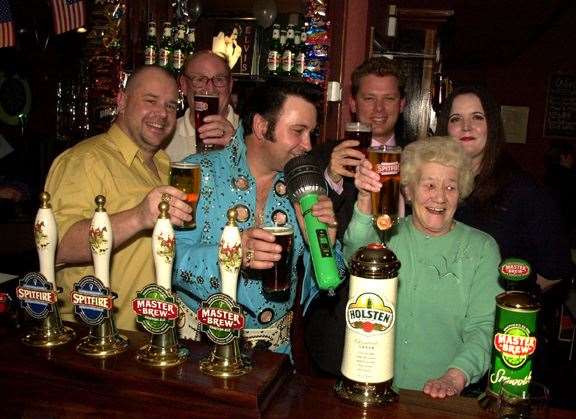 Staff at the Duke of Edinburgh pub in Barming, Maidstone, celebrate its re-opening in January 2002. It is now known as the Rockin Robin on the Green
