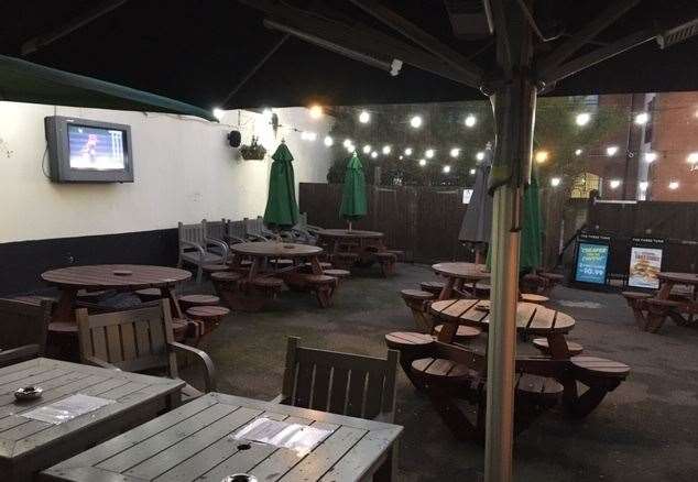 Maybe it was a little chilly, so the beer garden was deserted, but the TV screen was still playing