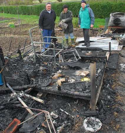 Allotments manager Chris Woolmough, and allotment users Pete Sudell and Norman Eyers survey the damage. Picture: BARRY DUFFIELD