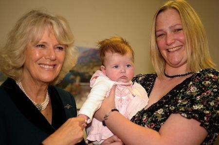 HRH Camilla, Duchess of Cornwall with three month old Jemima Winstanley and mother Nicola.