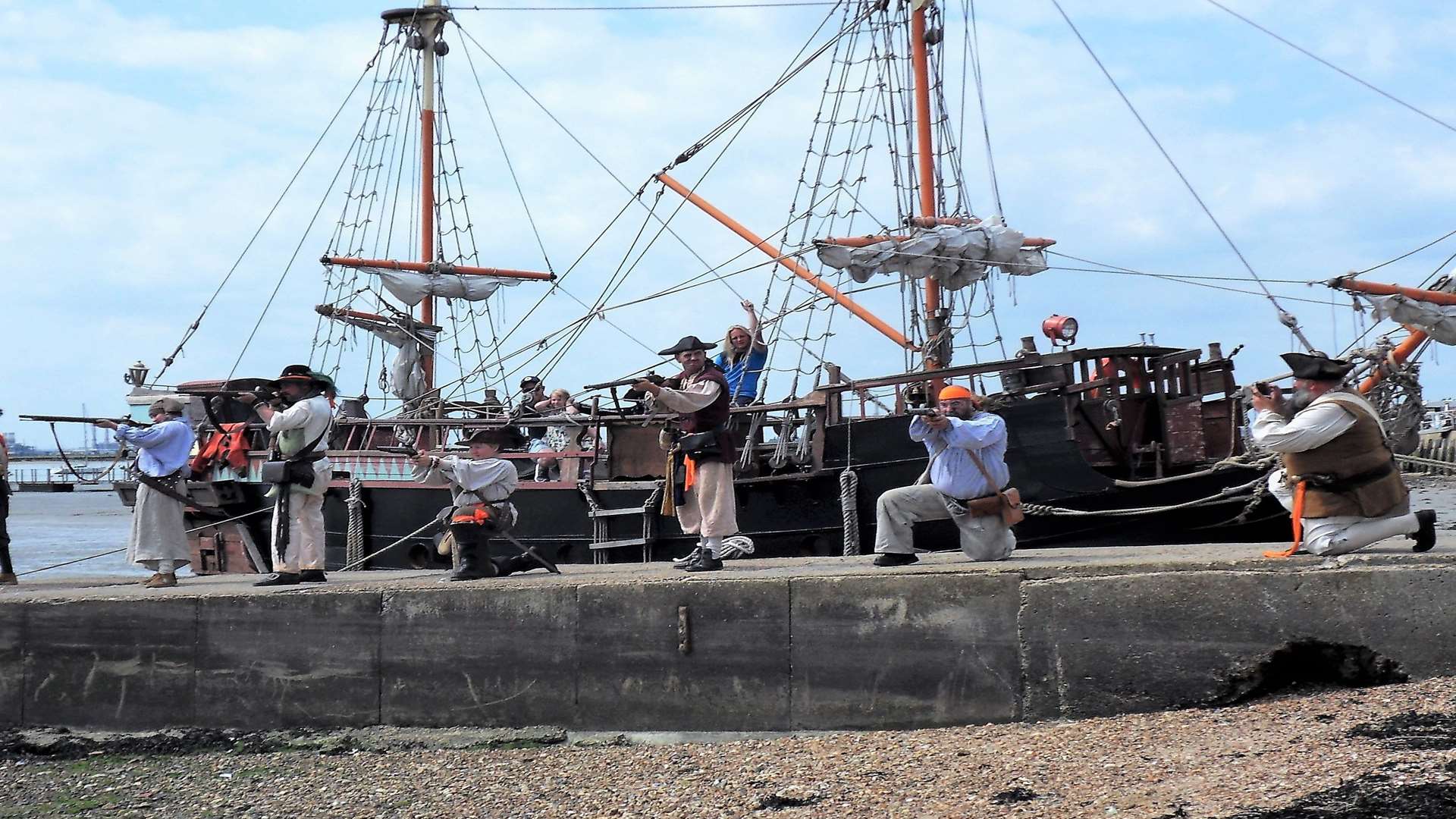 Take aim: The Sheppey Pirates led by Captain Cutlass (Adrian Collins) made a noisy entrance with muskets to mark the 350th anniversary of the Dutch invasion of Queenborough. Picture:George Poules