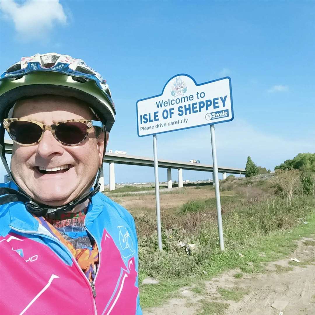 Former children's TV presenter Timmy Mallett at the welcome sign to the Isle of Sheppey. Copyright Timmy Mallett timmymallett.co.uk