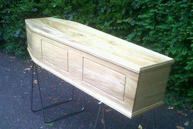 Generally such funerals include a coffin and the services of a funeral director. Stock picture
