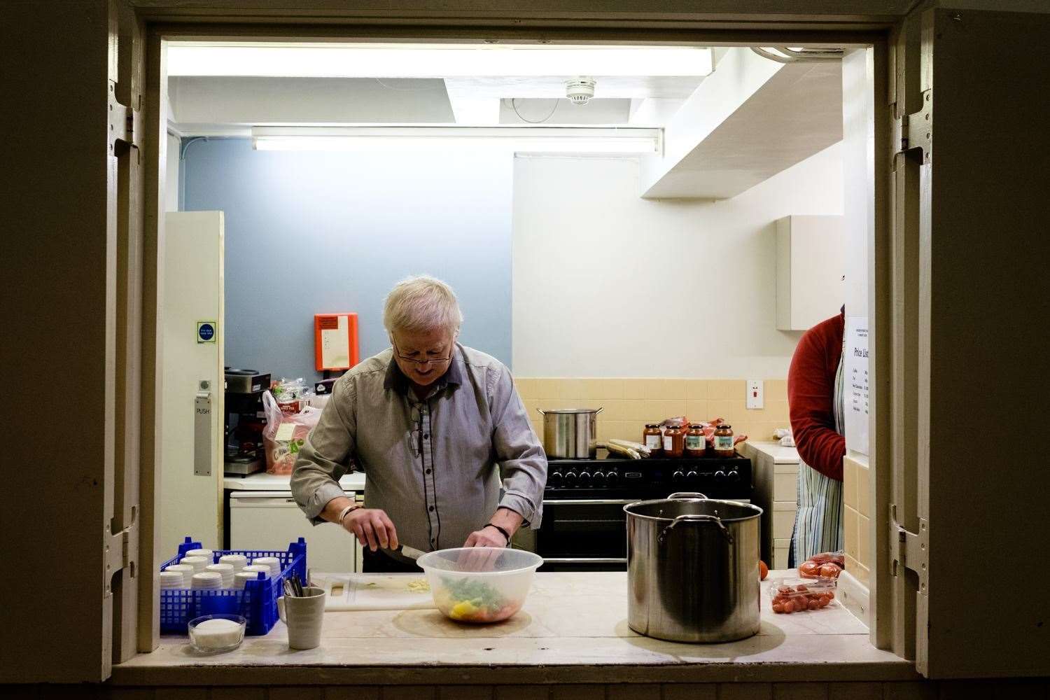 A volunteer working at a kitchen facility for the Gravesham Sanctuary