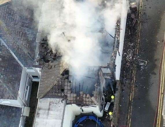 A property’s roof was destroyed by the fire. Picture: UKNIP
