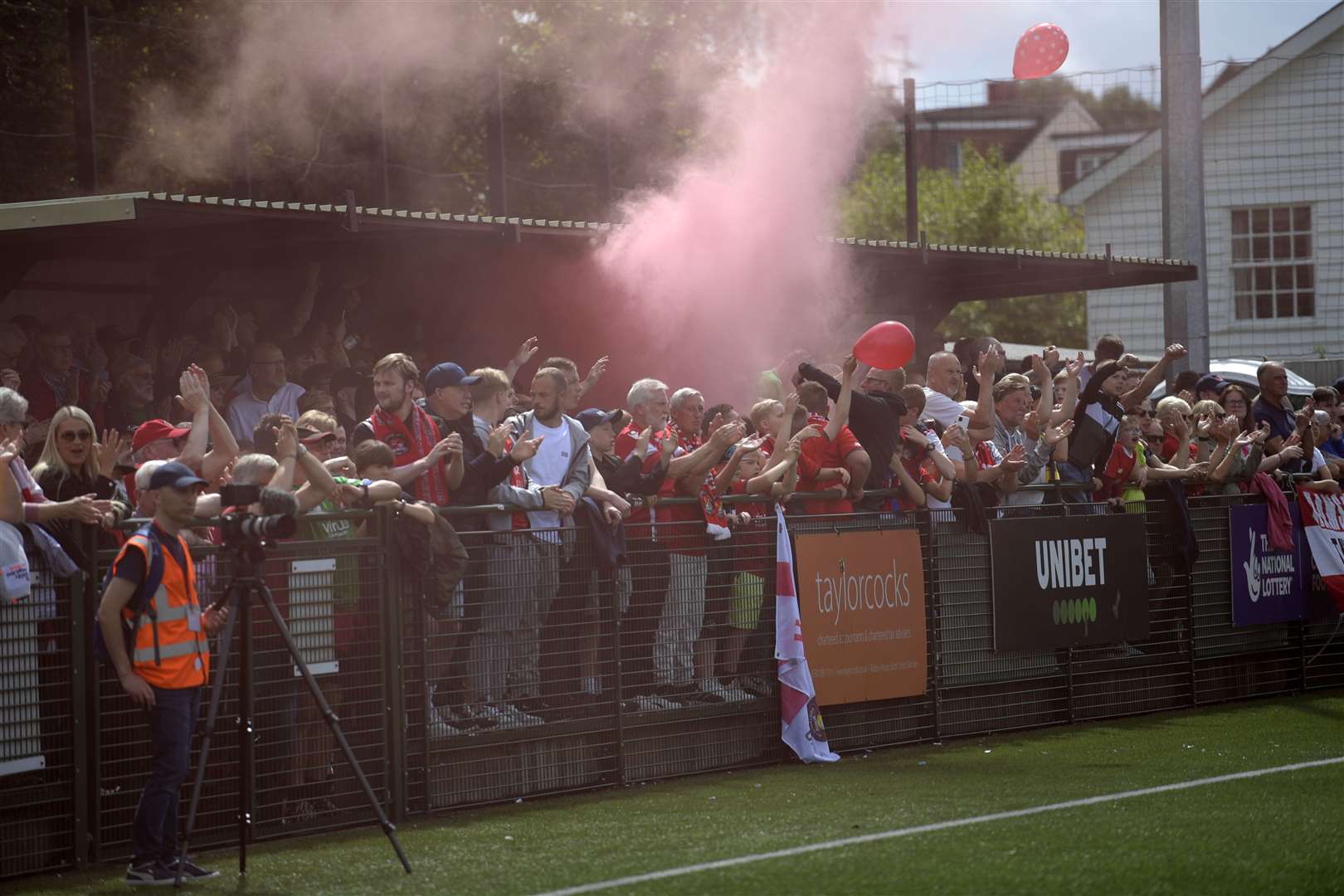 A smoke bomb among Ebbsfleet fans during their play-off final loss at Dorking. Picture: Barry Goodwin