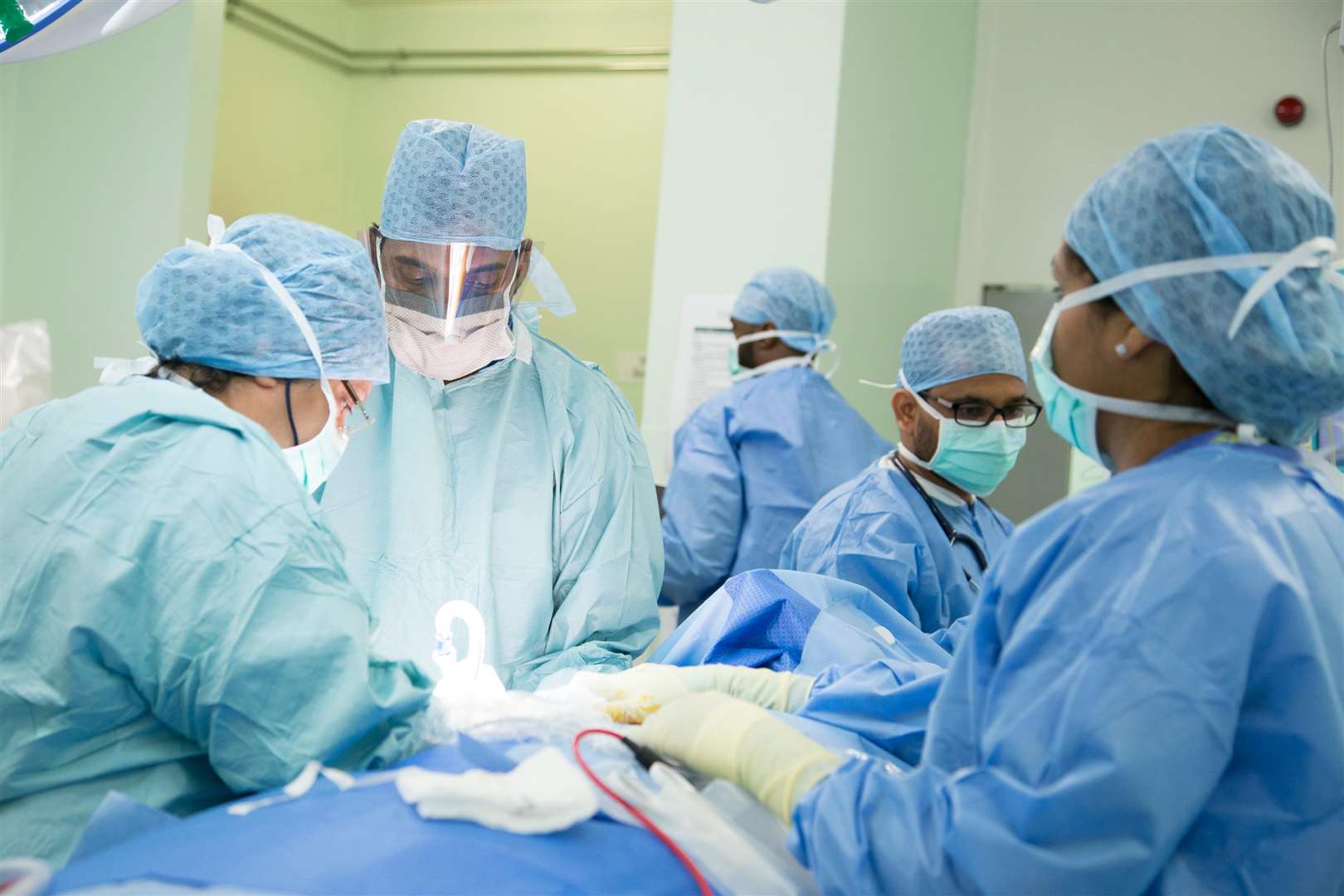 Surgery being carried out in an operating theatre at Medway Maritime Hospital