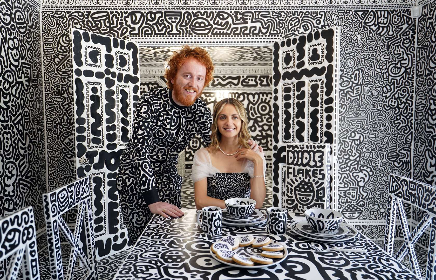 Sam Cox, aka Mr Doodle, with his wife Alena in the Doodle House (Gareth Fuller/PA)