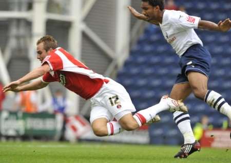 Luke Varney is fouled by Preston's Youl Mawene in the box. Picture: Barry Goodwin