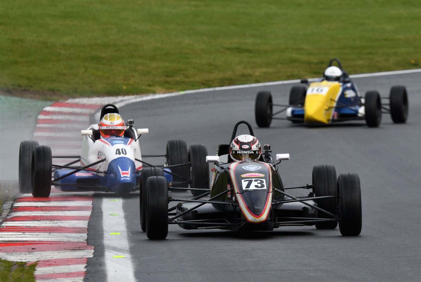 Romanek, who also claimed the Champion of Brands title this season, leads Andrew Rackstraw and Jacob Tofts through Graham Hill Bend. Picture: Simon Hildrew
