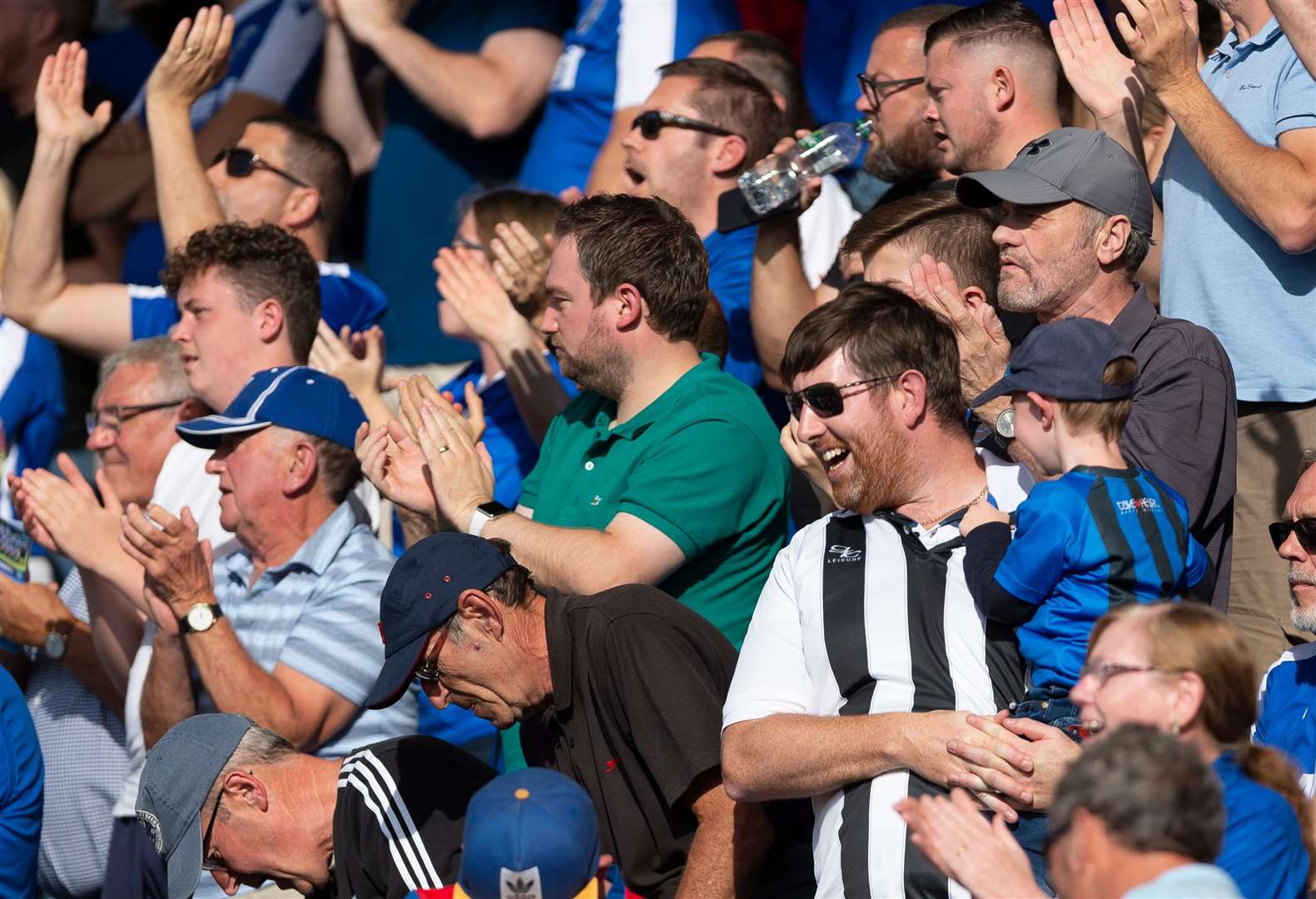 Gillingham fans celebrate against Wycombe on Saturday. Picture: Ady Kerry