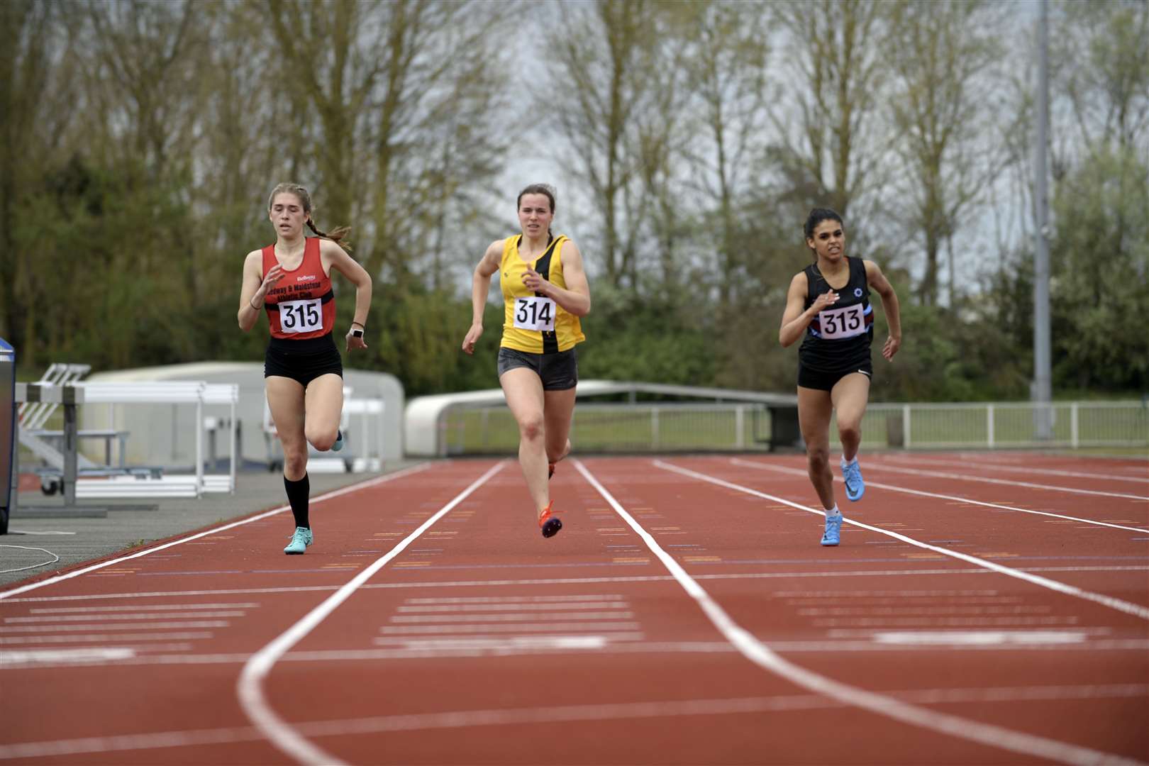 Charlotte de la Porte-Godden (Medway and Maidstone AC), Imogen Davis (Ashford AC) and Chanelle Cole (Blackheath & Bromley Harriers) in 200m sprint action Picture: Barry Goodwin