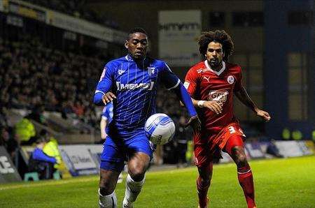 Crawley Town's Dean Howell (right) with Gillingham's Dennis Oli.