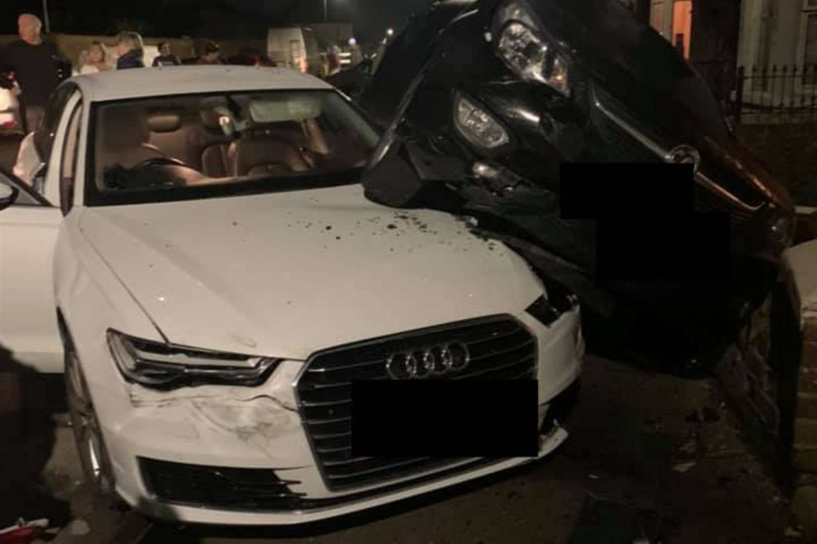 A white Audi ended up underneath another car. Photo: Marc Malki