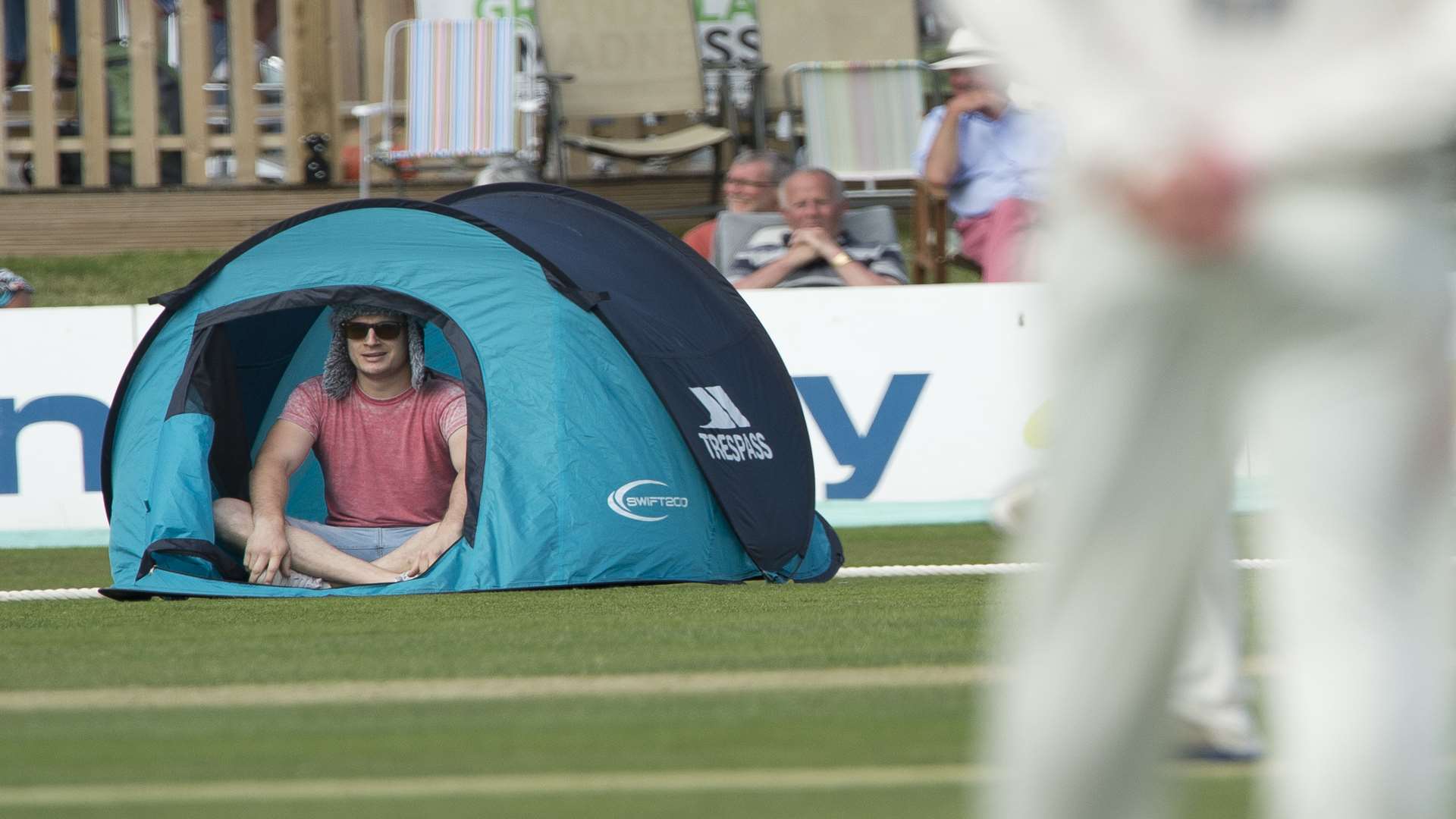 Players look on bewildered as prankster pitches tent in the outfield. Pic: Ady Kerry