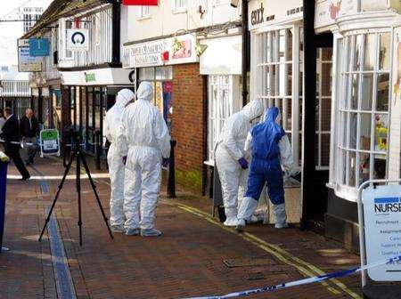 Police forensics officers at Esacks Hair and Beauty in Ashford High Street. Picture: Andy Clark
