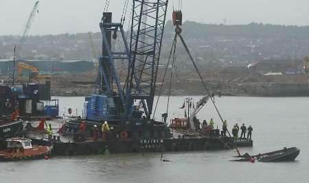 The barge is lifted from the water. Picture: PETER STILL