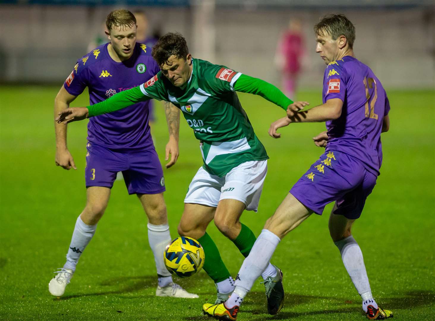 Rhyle Ovenden picks his way past two Burgess Hill players. Picture: Ian Scammell